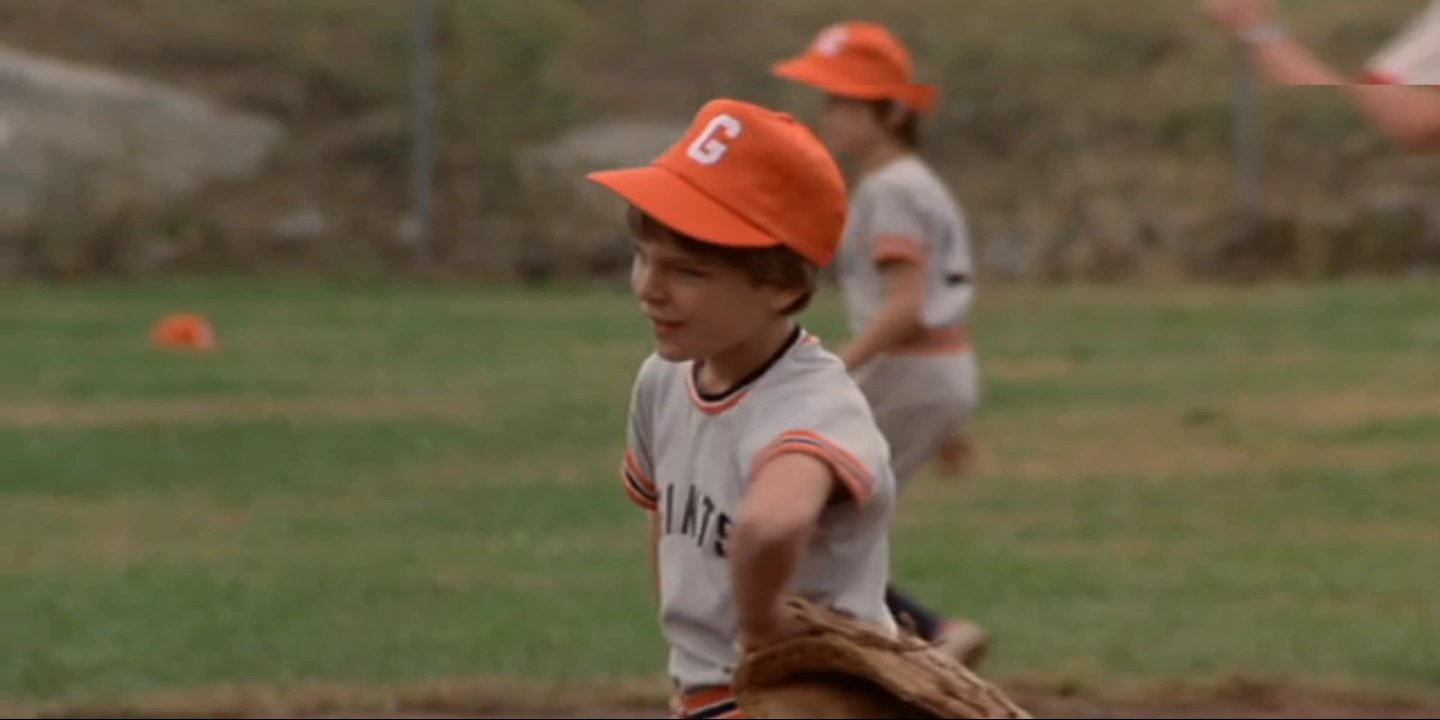 Mircea Oprea pitching for the Giants during a little league game upset as Umeki Siddaharo (played by Ted Oyama) knocks it over the fence in Here Come the Tigers 1977