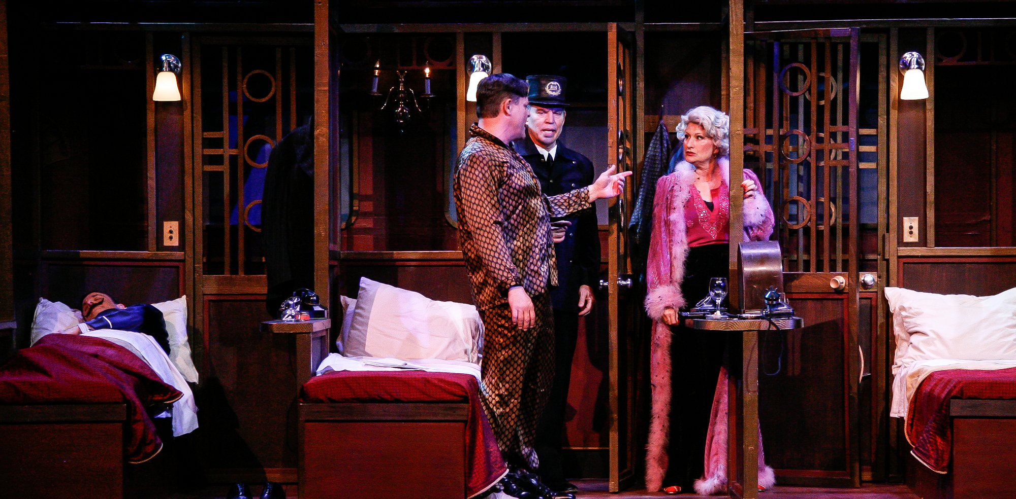 Samuel Ratchett (Mircea Oprea) and Helen Hubbard (Tiffany Story) argue with Michel, the Conductor (Raymond Wallenthin) while Hercule Poirot (Matthew Tavianini) Sleeps in Murder on the Orient Express at the Garvin Theatre - Santa Barbara, CA photo by Pam Lasker